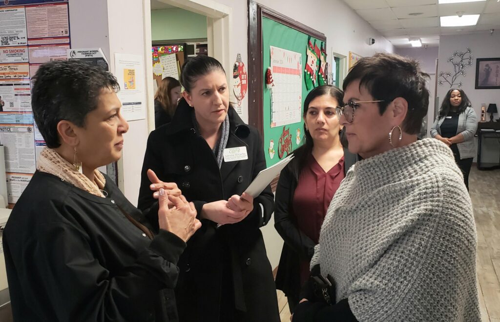 Congresswoman Manley speaking with Transitional Care STaff